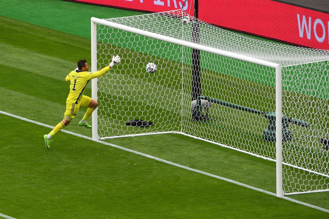 Scotland goalkeeper David Marshall couldn't get back in time and watched as the ball sailed over him. 