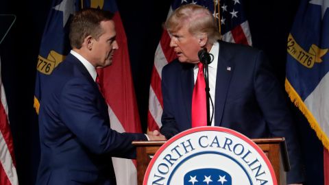 Former President Donald Trump, right, announces his endorsement of US Rep. Ted Budd, left, for the 2022 North Carolina US Senate seat as he speaks at a Republican convention earlier this month in Greenville, North Carolina. 