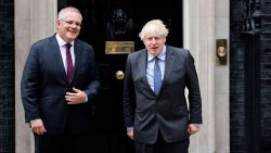 Britain's Prime Minister Boris Johnson (R) poses for a photograph with Australia's Prime Minister Scott Morrison (L) on the steps of 10 Downing Street in London on June 14, 2021. (Photo by Tolga Akmen / AFP) (Photo by TOLGA AKMEN/AFP via Getty Images)