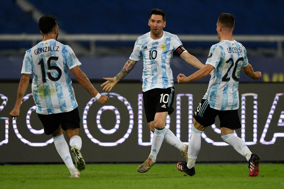Messi celebrates with teammates Nicolas Gonzalez and Giovani Lo Celso after scoring a free-kick against Chile.