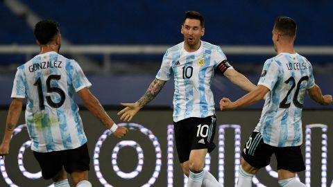Messi celebrates with teammates Nicolas Gonzalez and Giovani Lo Celso after scoring a free-kick against Chile.