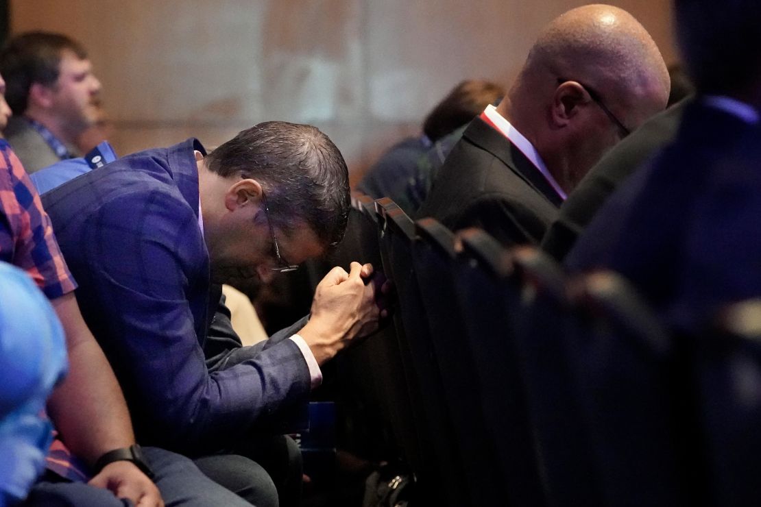 A man prays during the executive committee plenary meeting at the Southern Baptist Convention's annual meeting Monday, June 14, 2021, in Nashville, Tennessee. 