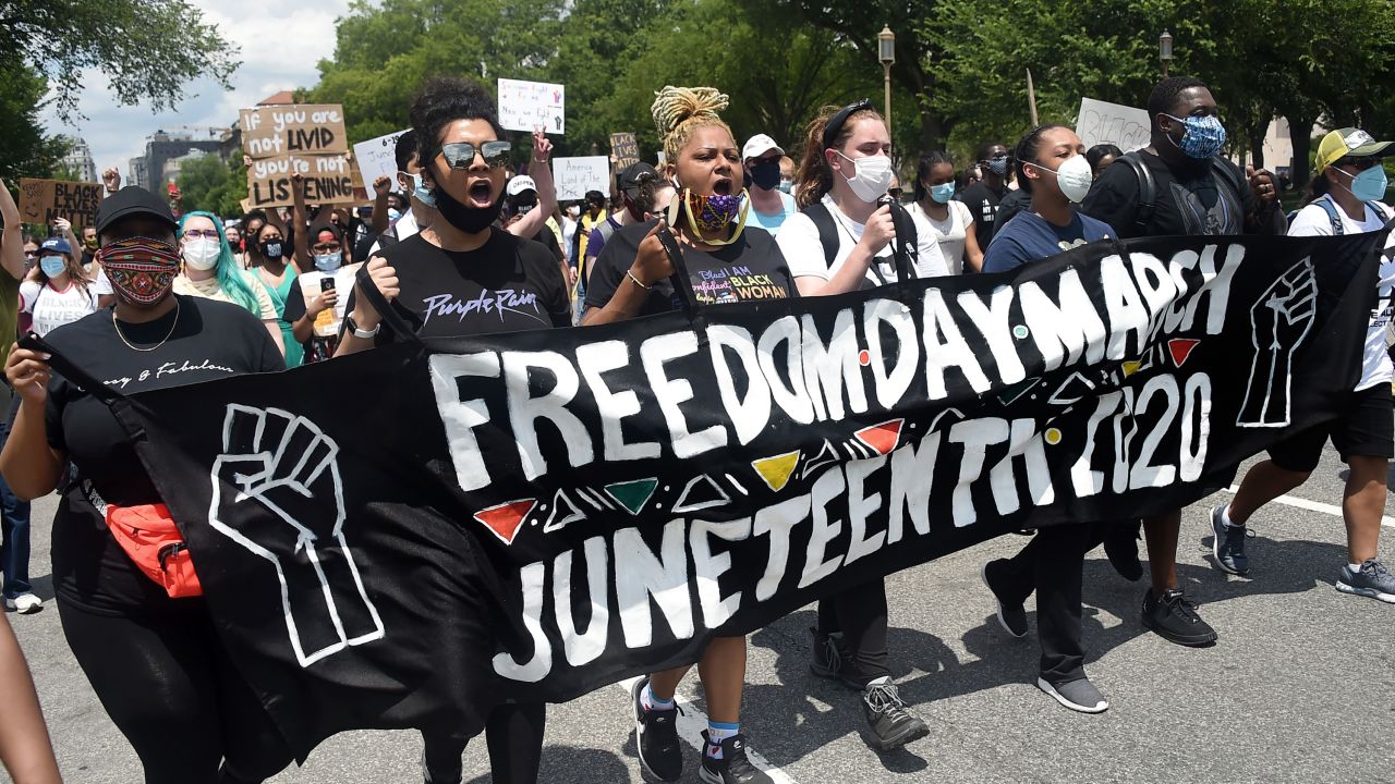 Demonstrators chant during a Juneteenth march and rally in Washington, D.C. on June 19, 2020.