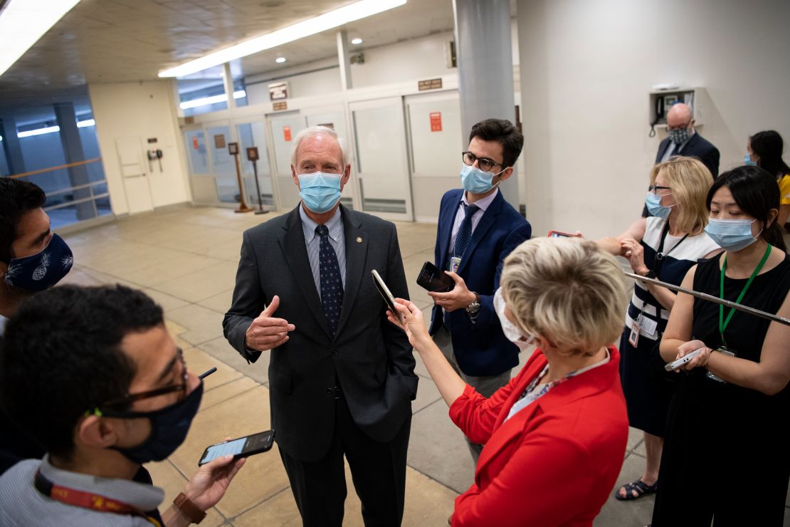 Sen. Ron Johnson of Wisconsin talks to reporters on his way to a vote in the Capitol on July 22, 2020.