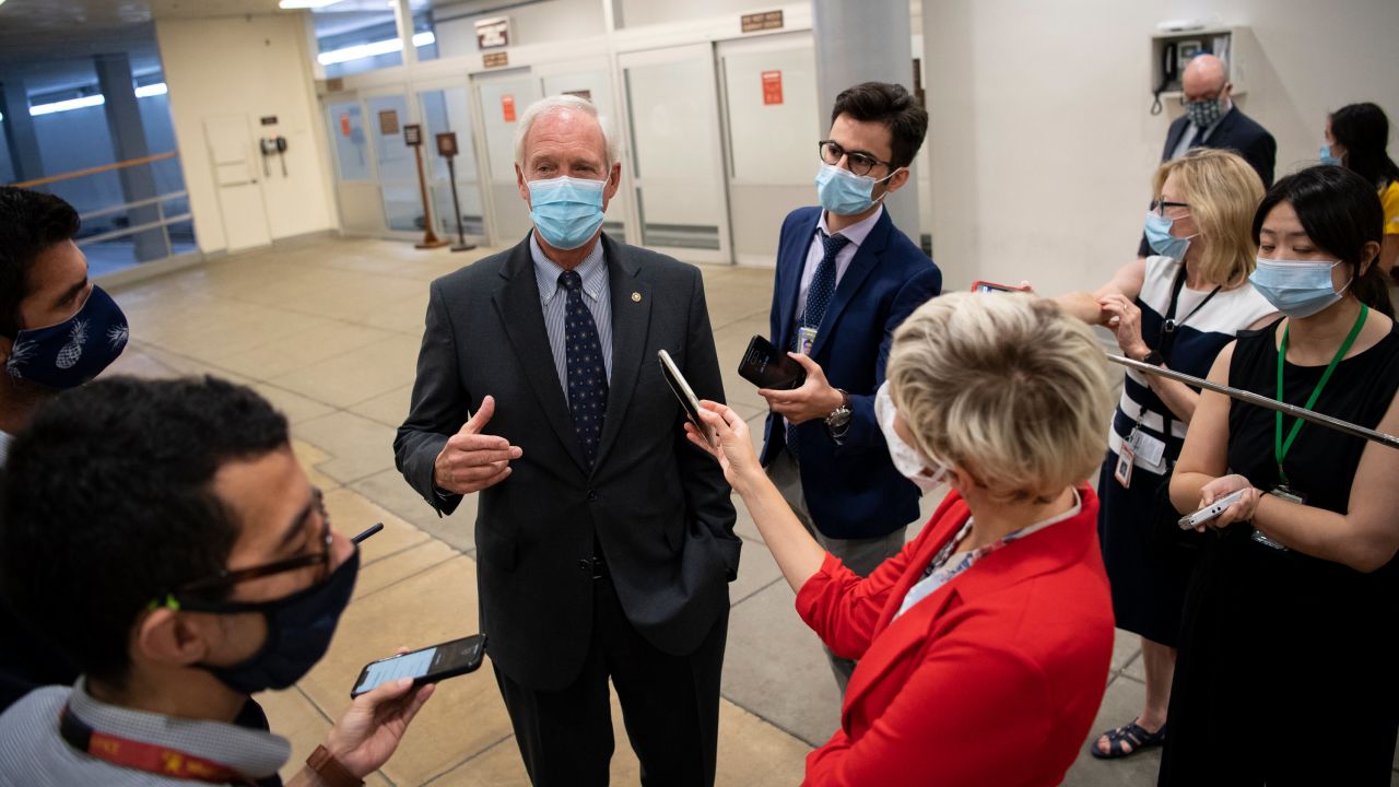Sen. Ron Johnson of Wisconsin talks to reporters on his way to a vote in the Capitol on July 22, 2020.
