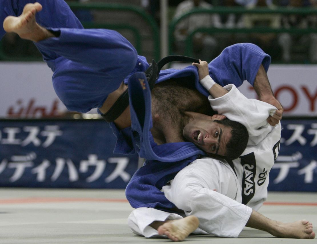 Iran's Vahid Sarlak duels with Spain's Javier Fernandez in the up to and including 60 kgs men's open category during the World Judo Championships in Cairo in September 2005. Sarlak says he was forced to default from the tournament after he'd been drawn against an opponent from Israel. 