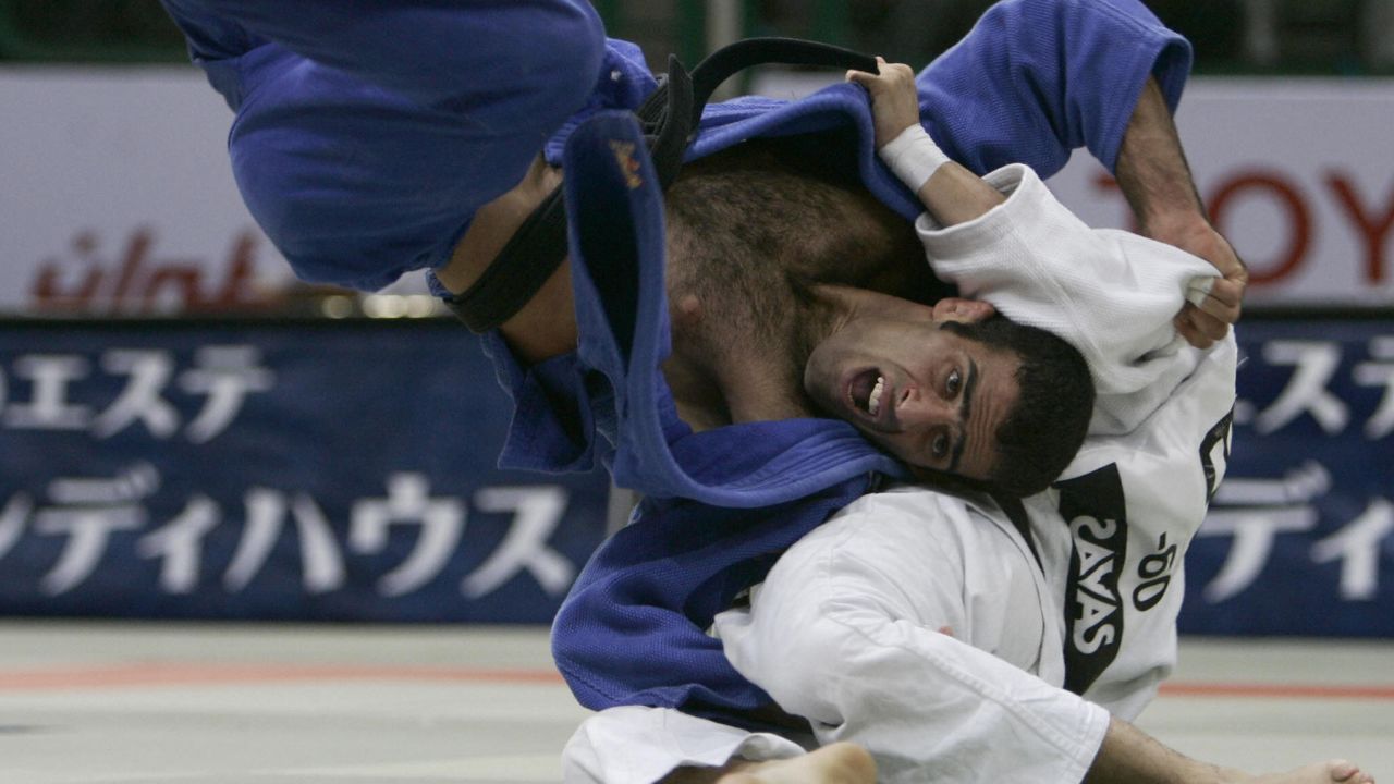 Iran's Vahid Sarlak duels with Spain's Javier Fernandez in the up to and including 60 kgs men's open category during the World Judo Championships in Cairo in September 2005. Sarlak says he was forced to default from the tournament after he'd been drawn against an opponent from Israel. 