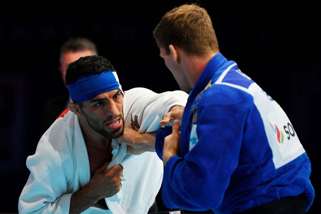 Iran's Saeid Mollaei (in white) fights against Belgium's Matthias Casse during the semifinal of the men's under 81kg category during the 2019 Judo World Championships at the Nippon Budokan, a venue for the upcoming Tokyo 2020 Olympic Games. Mollaei, who claimed he was ordered to deliberately lose a world championship fight, could compete under a refugee flag at the 2020 Tokyo Olympics, officials said on September 1.  