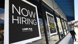 A pedestrian walks by a Now Hiring sign outside of a Lamps Plus store on June 03, 2021 in San Francisco, California. According to a U.S. Labor Department report, jobless claims fell for a fifth straight week to 385,000. 
