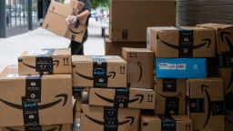 Amazon.com Inc. packages sit stacked on the sidewalk in New York, U.S., on Thursday, June 11, 2020. New York streets got a little more congested this week as the city entered Phase 1 of its re-opening from the coronavirus-imposed lockdown.