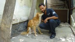 Dr. Reshad with Julie, one of 1,600 dogs Nowzad has helped reunite with soldiers who rescued them since 2006. The group does not use surnames of Afghani staff to protect their families.