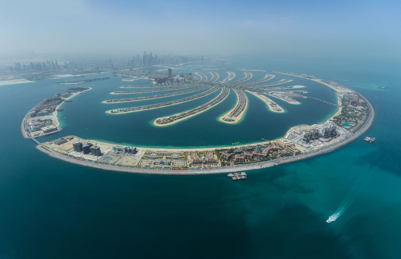 The Palm Jumeirah is an artificial set of islands off the coast of Dubai's mainland. This aerial view from a hydroplane shows the palm tree shape, surrounded by a crescent breakwater that protects the islands from high winds and waves.