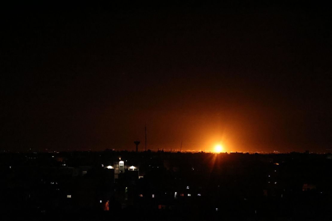 Explosions light up the night sky as the Israeli military strikes Khan Younis in southern Gaza, early on June 16.
