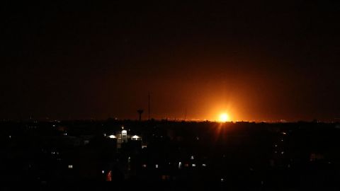 Explosions light up the night sky as the Israeli military strikes Khan Younis in southern Gaza, early on June 16.