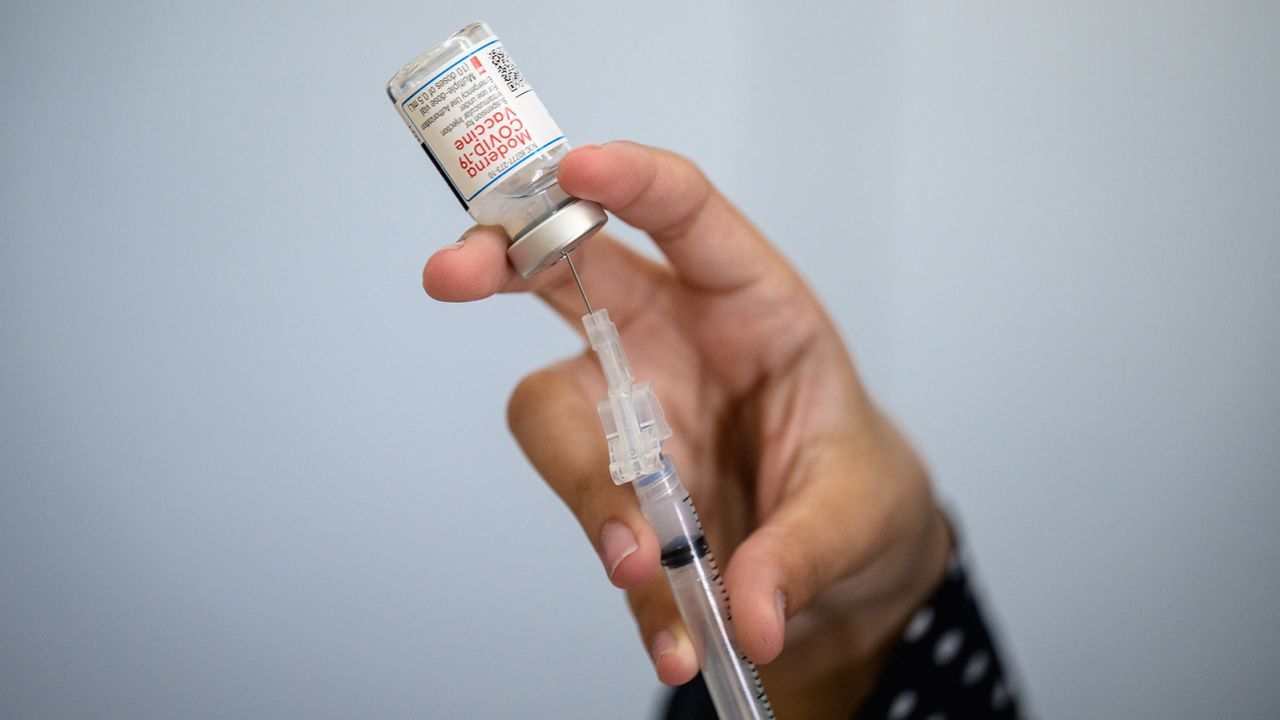 A medical staff member prepares a syringe with a vial of the Moderna Covid-19 vaccine at a pop up vaccine clinic at the Jewish Community Center on April 16, 2021 in the Staten Island borough of New York City. (Photo by Angela Weiss / AFP) (Photo by ANGELA WEISS/AFP via Getty Images)