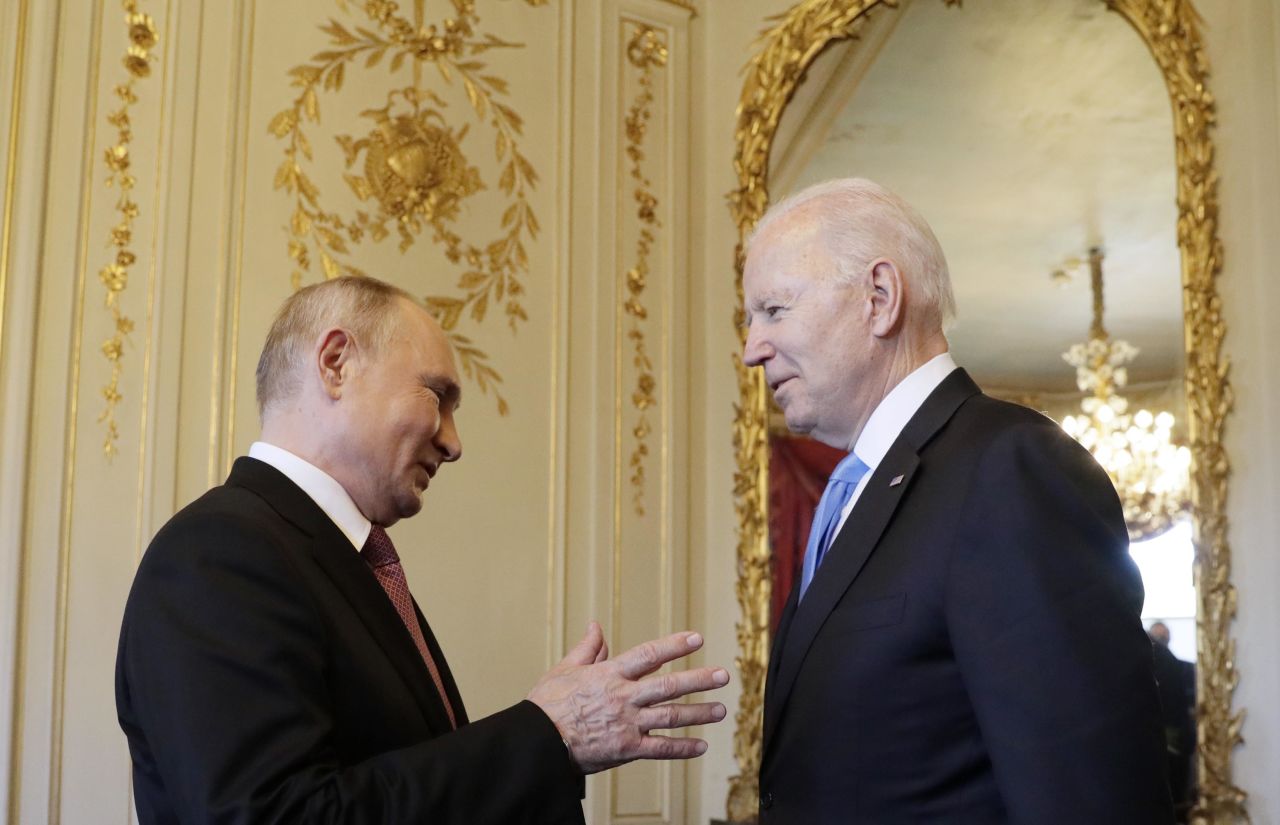 Putin and Biden talk before their first sit-down meeting.