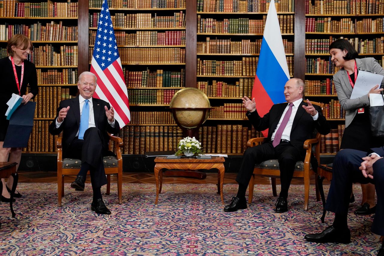 Biden and Putin share a laugh during the summit.