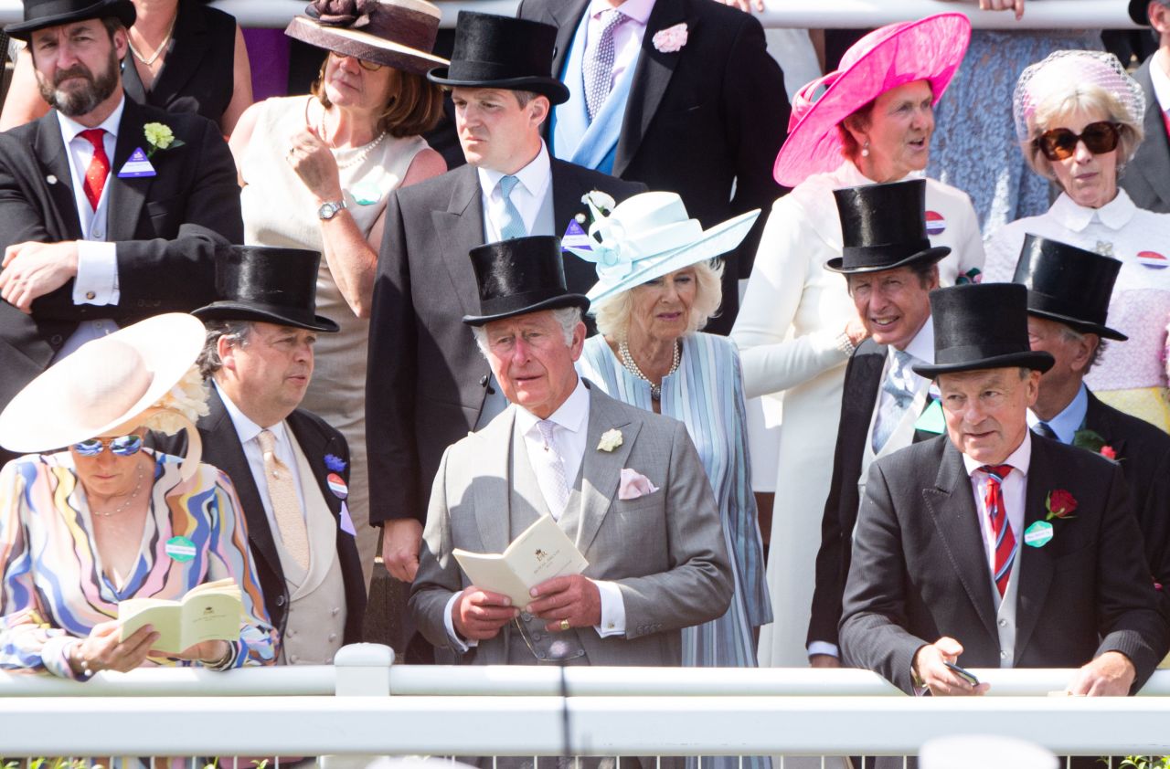 Amid a sea of guests, Prince Charles and Camilla, the Duke and Duchess of Cornwall, wore gray and sky blue respectively.