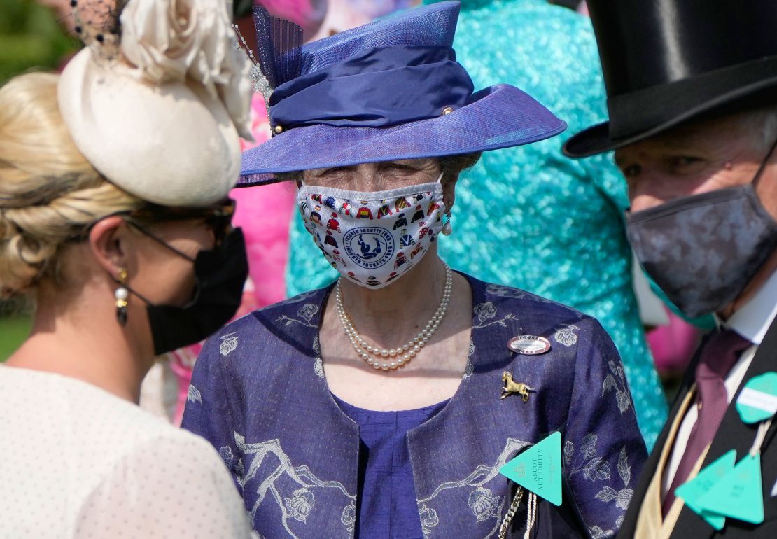 Princess Anne wore a deep blue ensemble with a bespoke face covering on the first day of Royal Ascot. 
