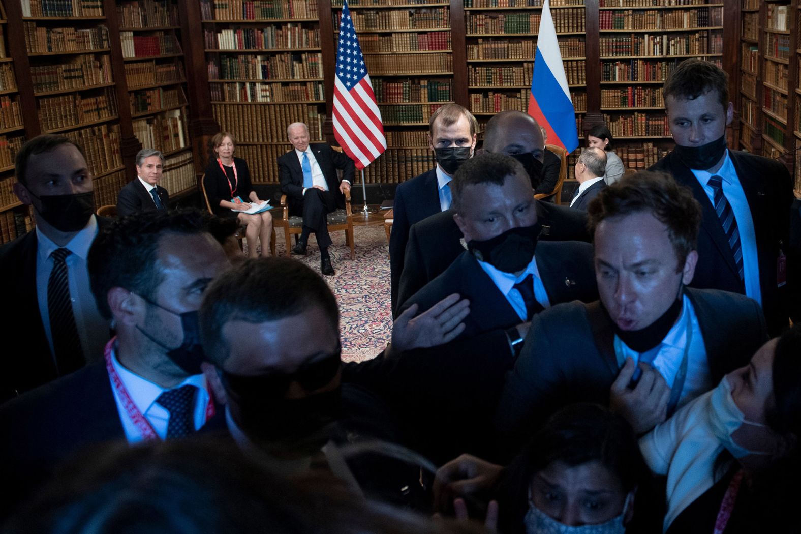 Security guards push the press out of the room during the opening remarks.