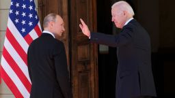 US President Joe Biden waves next to Russian President Vladimir Putin during their meeting at the 'Villa la Grange' in Geneva on June 16, 2021.