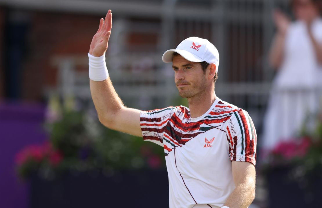 Andy Murray waves to the crowd after beating Benoît Paire.
