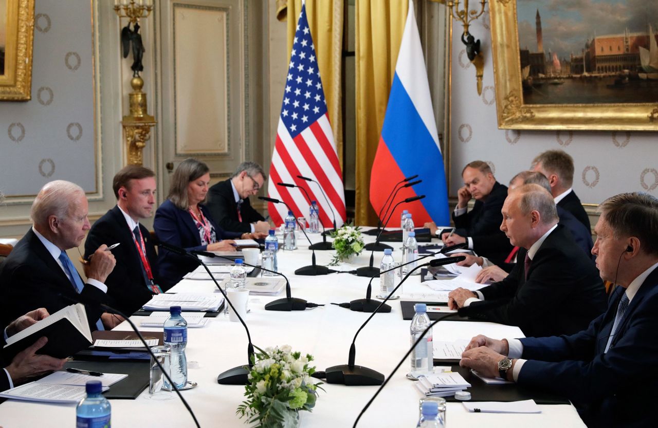 Biden and Putin hold an extended meeting with members of their teams.
