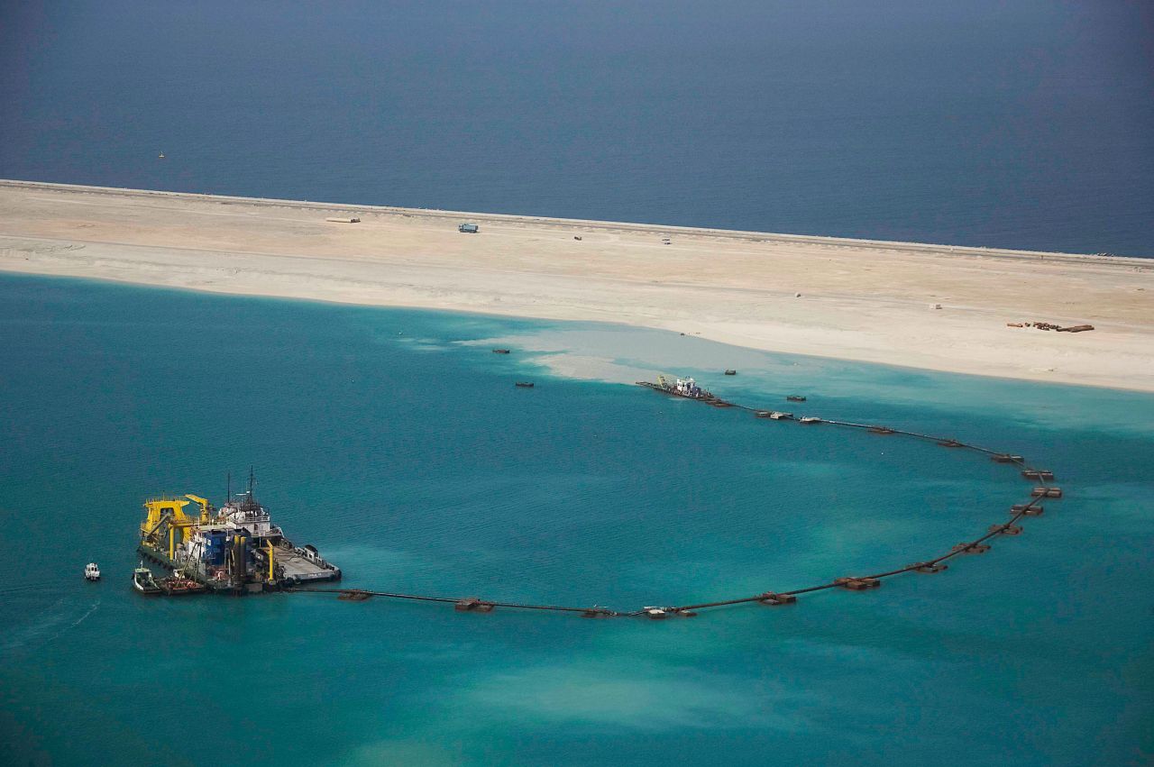 Construction on the project began 20 years ago, in June 2001. No steel or concrete was used to form the islands. Instead, developer Nakheel used sand and rock. Here, the breakwater crescent is being built in 2003.