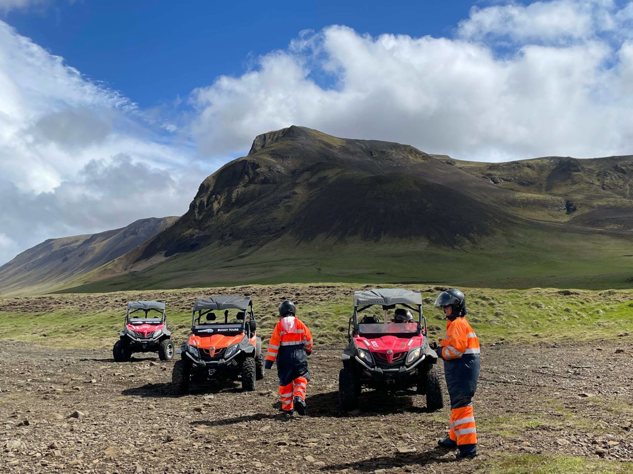 Visitors prepare to drive ATVs near Seljalandsfoss on a tour to the Þórsmörk Valley.