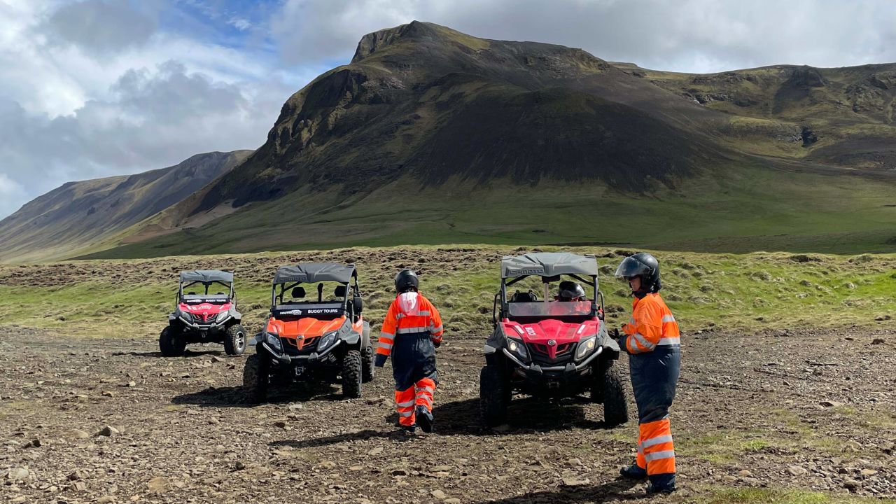 Visitors prepare to drive ATVs near Seljalandsfoss on a tour to the Þórsmörk Valley.