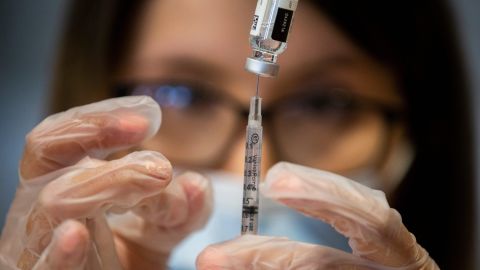 Pharmacist Anais Martinez prepares a Covid-19 vaccine to be administered April 9, 2021, at Holy Spirit Catholic Church in Horizon City, Texas.