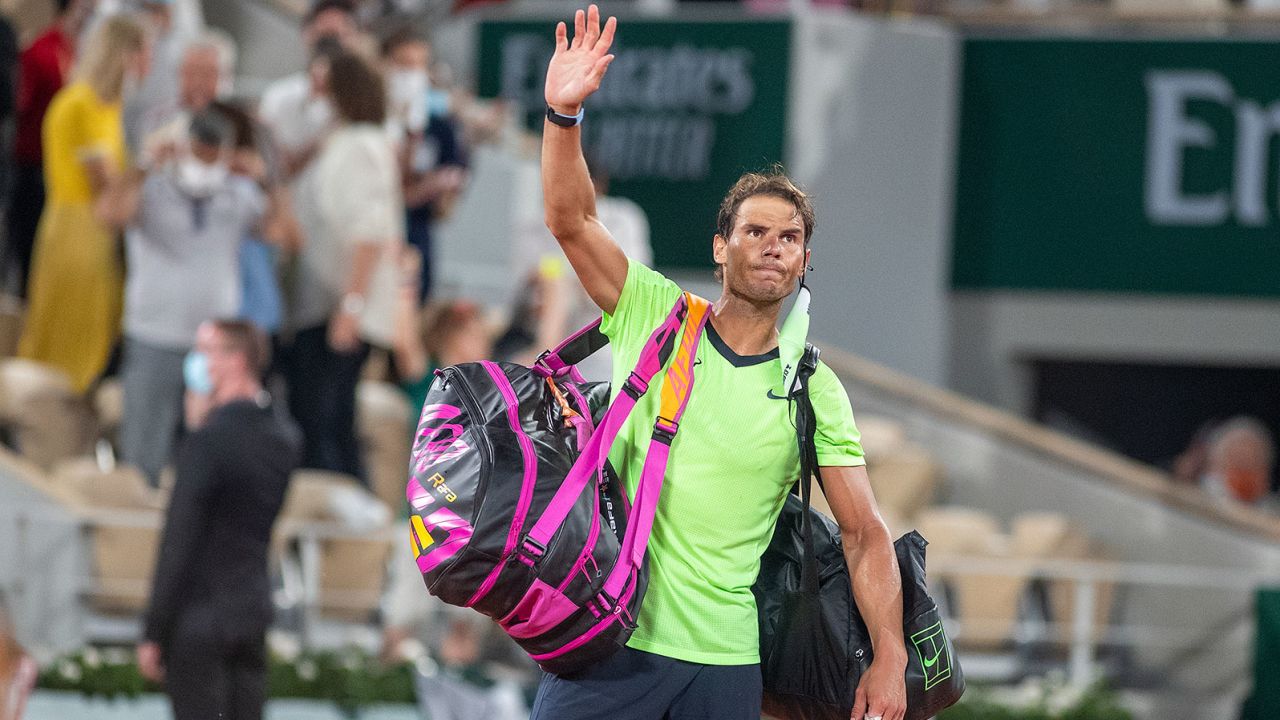 Rafael Nadal waves to the crowd after his French Open semifinal defeat to Novak Djokovic.
