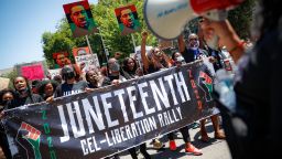 In this June 19, 2020 photo protesters chant as they march after a Juneteenth rally at the Brooklyn Museum, in the Brooklyn borough of New York. 