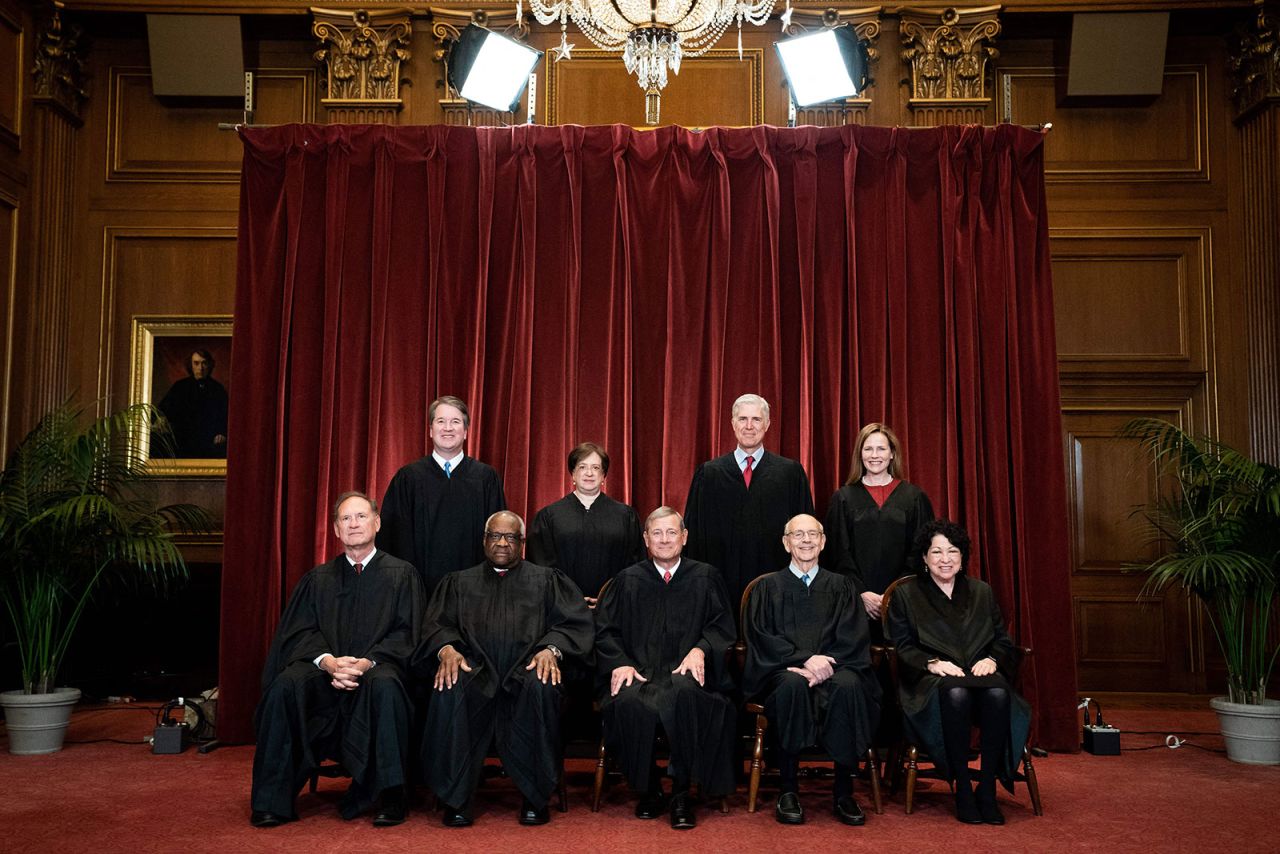 Thomas poses with his Supreme Court colleagues in April 2021.