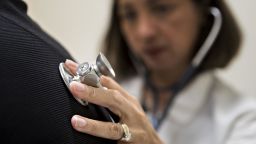 A medical doctor examines a patient with a stethoscope at a CCI Health and Wellness Services health center in Gaithersburg, Maryland, in April 2017. 