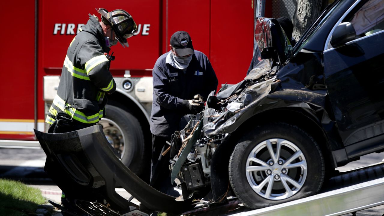 A car is towed away after crashing into a home in Quincy, Massachusetts, on May 13, 2020.