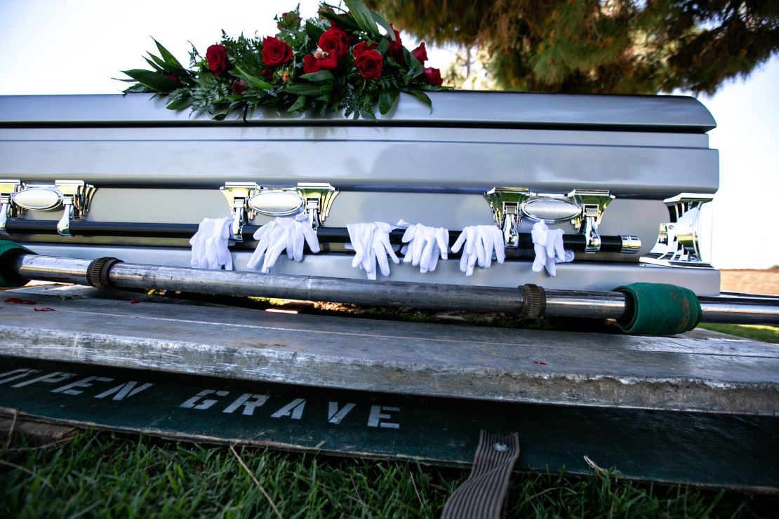 Gloves worn by pallbearers are draped on the casket of retired officer Charles Jackson Jr., who died from Covid-19 in April 2020 in Los Angeles. Covid restrictions prevented many people from saying goodbye to dying loved ones in person.