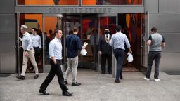 People enter the Goldman Sachs headquarters building in New York, U.S., on Monday, June 14, 2021. Goldman Sachs Group Inc. is bringing thousands of employees back to the office across the U.S. Monday for the first time in more than a year. 