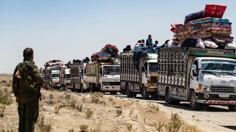 Families sit in trucks after their release from a camp holding relatives of suspected Islamic State fighters in northeastern Syria.