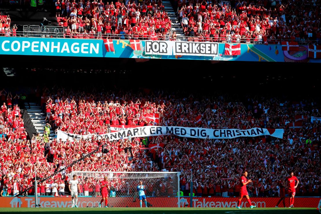 A banner of support was raised as those inside the stadium paid tribute. 