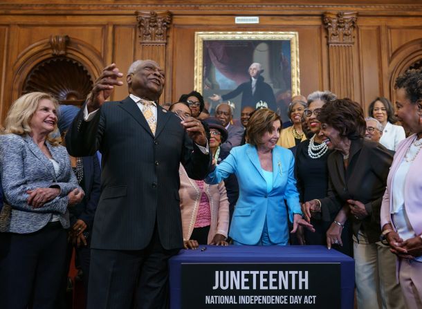 House Majority Whip James Clyburn, left, celebrates with House Speaker Nancy Pelosi, center, and members of the Congressional Black Caucus on Thursday, June 17, after passing legislation <a href="https://www.cnn.com/2021/06/17/politics/biden-juneteenth-bill-signing/index.html" target="_blank">to make Juneteenth a federal holiday</a> in the United States. Juneteenth commemorates June 19, 1865, when Union Major General Gordon Granger announced the end of slavery in Galveston, Texas, in accordance with President Abraham Lincoln's 1863 Emancipation Proclamation. 