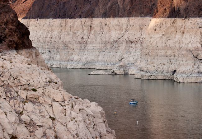 A boat cruises past mineral-stained rocks on the upstream side of Nevada's Hoover Dam on Tuesday, June 15. Lake Mead, the United States' largest reservoir, <a href="https://www.cnn.com/2021/06/17/us/lake-mead-drought-water-shortage-climate/index.html" target="_blank">is draining rapidly because of extreme drought.</a> On Wednesday, it registered its lowest level on record since it was filled in the 1930s.