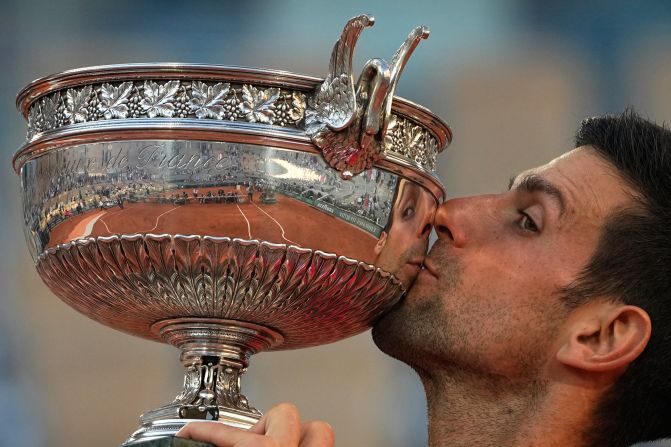 Novak Djokovic kisses his trophy after <a href="https://www.cnn.com/2021/06/13/tennis/novak-djokovic-stefanos-tsitsipas-french-open-final-spt-intl/index.html" target="_blank">winning the French Open title</a> on Sunday, June 13. It is his 19th grand slam singles title, which puts him just one behind the all-time record held by Roger Federer and Rafael Nadal.