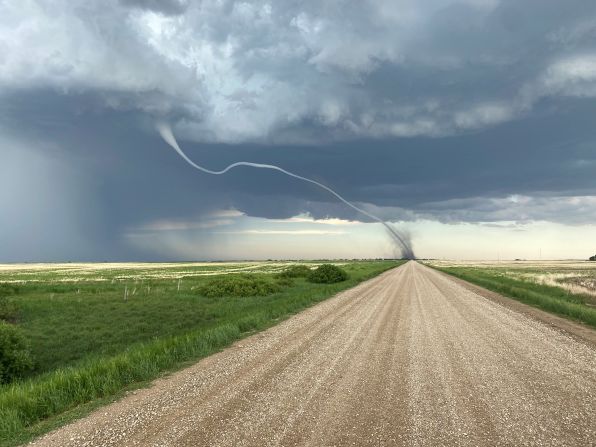 A tornado is seen in a field in D'arcy, Saskatchewan, on Tuesday, June 15.