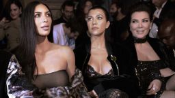 TOPSHOT - (From L) Kim Kardashian, Kourtney Kardashian and Kris Jenner attend the Off-white 2017 Spring/Summer ready-to-wear collection fashion show, on September 29, 2016 in Paris. / AFP / ALAIN JOCARD        (Photo credit should read ALAIN JOCARD/AFP via Getty Images)