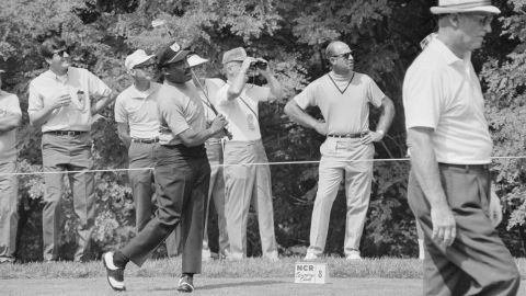 Sifford practices on the range.
