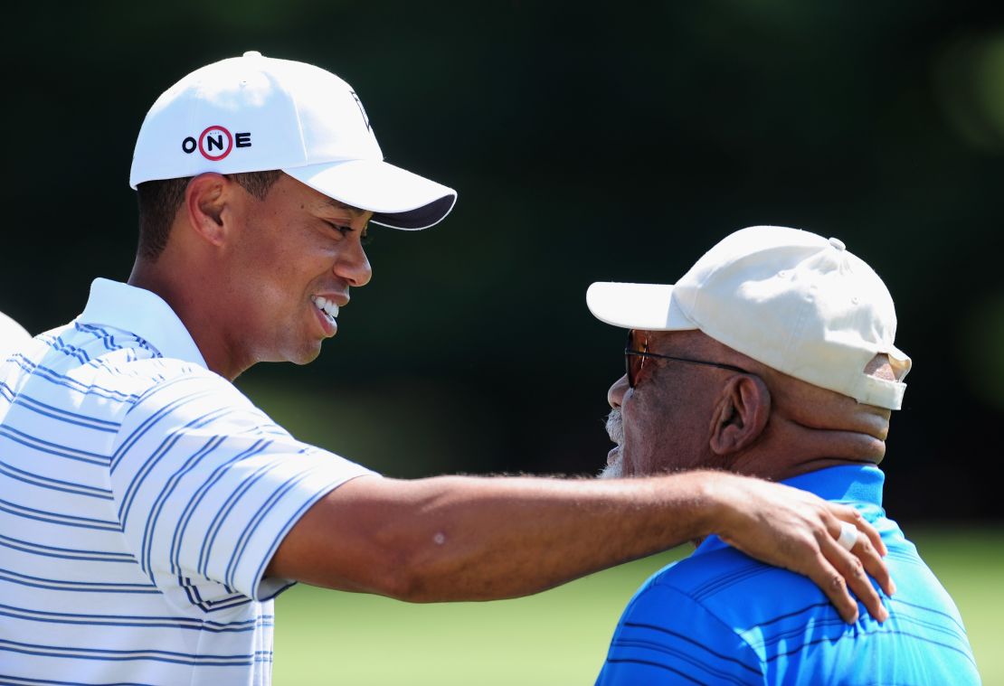 Tiger Woods with Sifford during a practice round of the World Golf Championship Bridgestone Invitational in 2009.