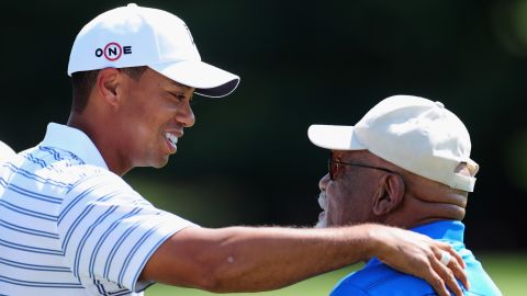 Tiger Woods with Sifford during a practice round of the World Golf Championship Bridgestone Invitational in 2009.