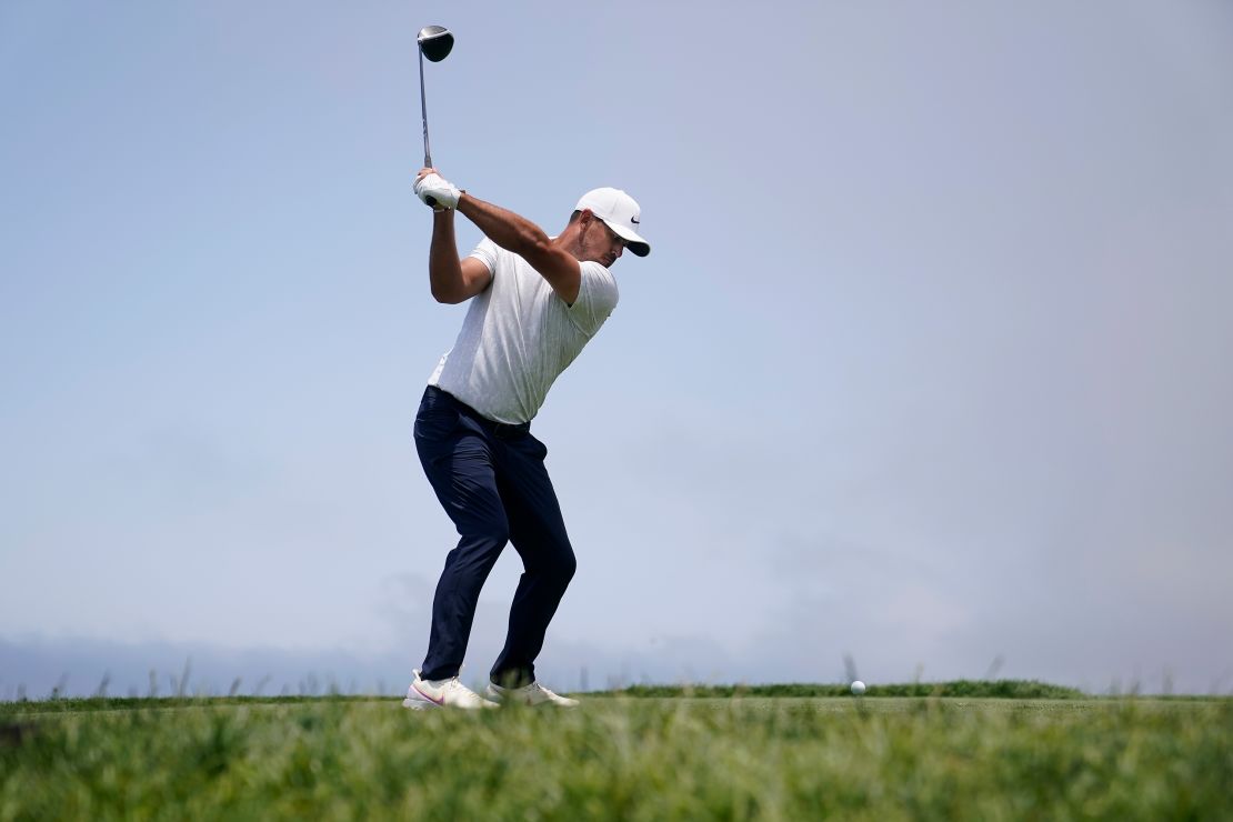 Koepka hits from the fourth tee during the first round of the U.S. Open.