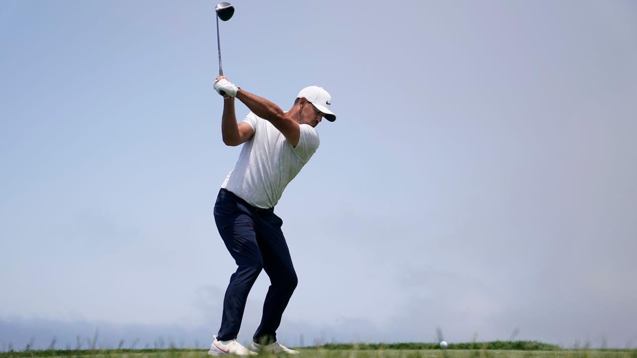 Koepka hits from the fourth tee during the first round of the U.S. Open.